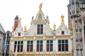 Fototapeta premium BRUGES, BELGIUM - April 13, 2018: Antique building view in Old Town Bruges, Belgium