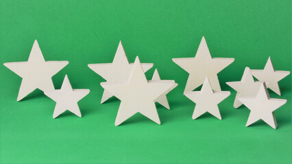 White stars on green background, representation of Christmas. 