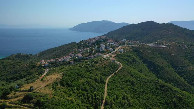 Aerial drone video of uphill breathtaking main town and castle of Alonissos island with views to Aegean sea, Sporades, Greece