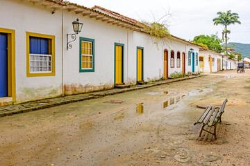 Sand street and old houses in colonial style on the streets of the old and historic city of Paraty founded in the 17th century on the coast of the state of Rio de Janeiro, Brazil