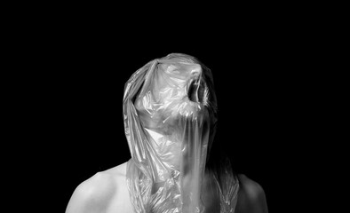 portrait strangulation, plastic bag on head - 393349066