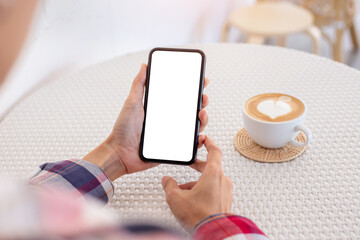cell phone blank white screen mockup.woman hand holding texting using mobile on desk at office.background empty space for advertise.work people contact marketing business,technology
