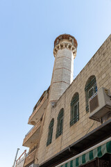 Obraz premium High minaret on El Wad HaGai Street in the old city of Jerusalem in Israel