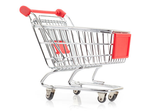 Shiny empty shopping cart with red handle, isolated on white background.