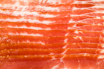 pieces of sliced bacon for background, close-up