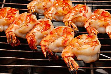  grilled shrimps on a grill