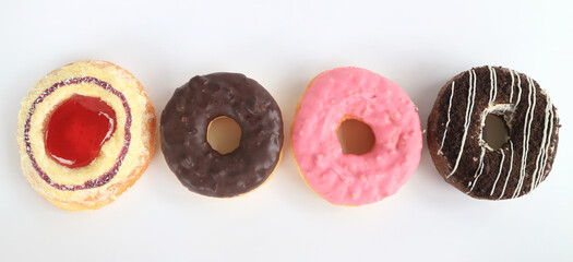 Set of four different glazed donuts on a white background.