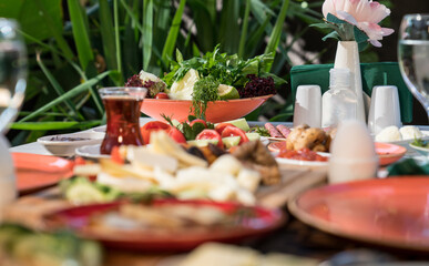 A healthy and beautiful breakfast with local organic and natural foods in the green garden of the hotel. food and drink holiday concept