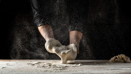 chef prepares the dough with flour to make pasta. Pizza dough. Cooking bread. Kneading the Dough....