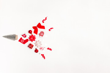 Fototapeta na wymiar Holiday winter white. Stocking, gifts, winter tree, ribbon and bow in Christmas composition on white background for greeting card. Flat lay, top view, copy space.