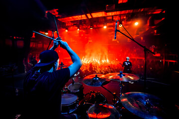 Rock concert poster. The drummer plays drums during the show