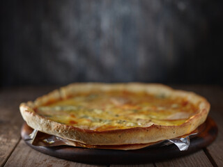 Rustic pizza on the kitchen table
