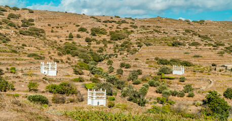 Fototapeta na wymiar Panoramic view of Dovecotes (pigeon houses) in the village of Tarambados on the Cycladic island of Tinos, Greece