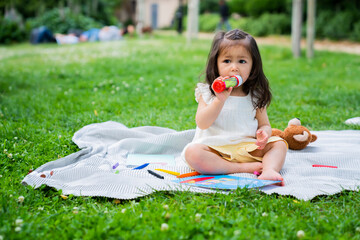 Little toddler girl holding bubble blower