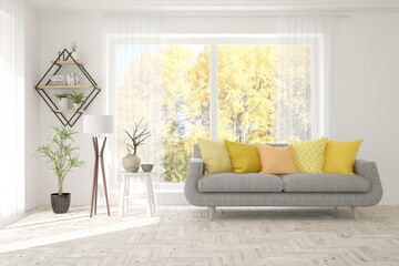 Stylish room in white color with sofa and autumn landscape in window. Scandinavian interior design. 3D illustration