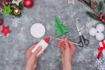 Christmas crafts - Christmas tree made of paper, step by step instructions. Step 31 - take PVA glue on the brush