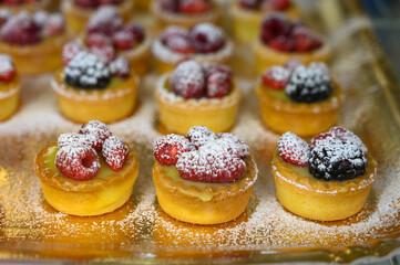 Wild strawberry and raspberry cakes in ancient city of strawberry Nemi, Castelli Romani, Italy