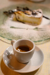 Classic italian espresso coffee served with homemade apple cheese cake with chocolate