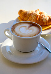 Breakfast coffee, Italian classic cappuccino with milk foam served in cafe