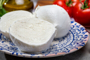 Fresh handmade soft Italian cheese from Campania, white balls of buffalo mozzarella cheese made from cow milk ready to eat