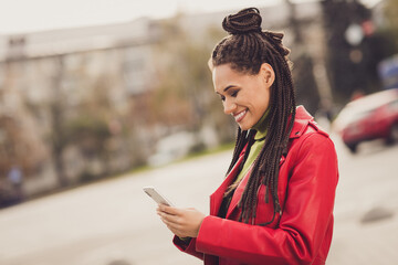 Profile side photo of young cheerful attractive afro woman happy positive smile use smartphone like post repost blogger