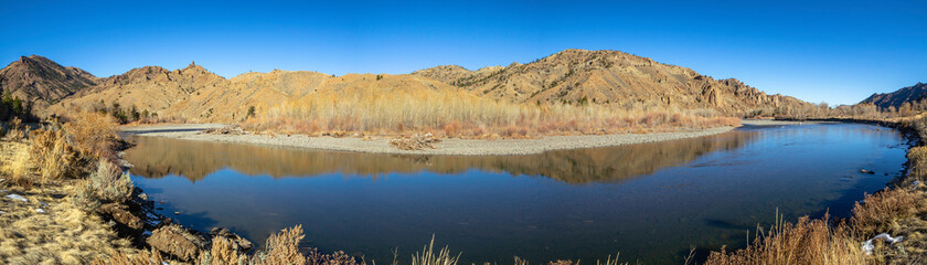 Panorama view of Yellowstones park lake and mountains  in autumn.