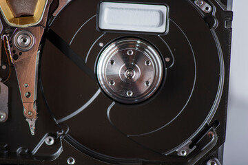 Disassembled dusty hard drive close-up.