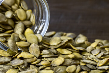 raw pumpkin seeds close-up. background with pumpkin seeds.