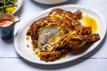 Whole roast chicken  with Indian spices and yogurt and almond masala