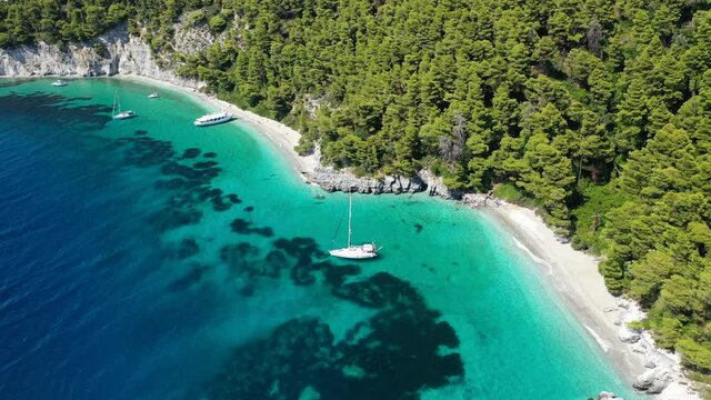 Aerial drone video of breathtaking secluded turquoise beaches of Ftelia and Megalo Pefko in island of Skopelos, Sporades, Greece