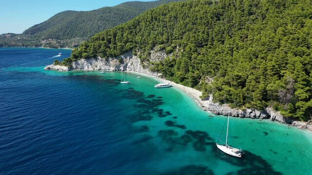 Aerial drone video of breathtaking secluded turquoise beaches of Ftelia and Megalo Pefko in island of Skopelos, Sporades, Greece
