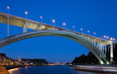 Modern bridge over the river at night