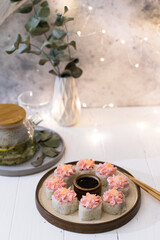 Sushi roll with pink cream, salmon