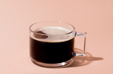 Black barley coffee on a cream background