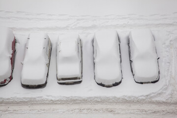 winter landscape with snow-covered cars