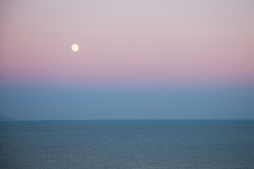 a moon over the sea