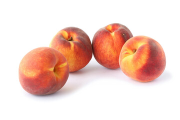 Several tasty peaches isolated on white