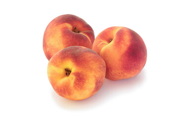 Three tasty peaches isolated on white