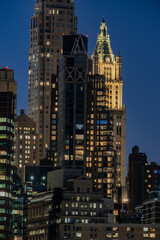 Fototapeta na wymiar New York City - USA - Nov 4 2020: Financial District Buidling on the East River at dusk