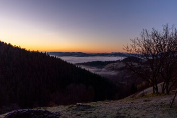 Fototapeta na wymiar sunrise view from the mountains of Romania autumn with fog
