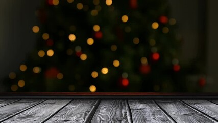 Animation of flickering fairy lights on christmas tree with wooden surface