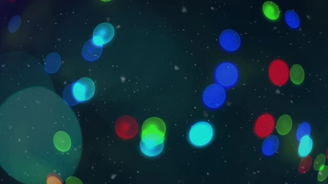 Animation of christmas fairy lights, snow falling on blue background