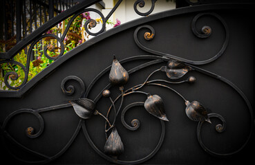 Decorative elements of a metal gate in the form of leaves