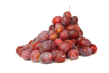 Heap of plums isolated on a white