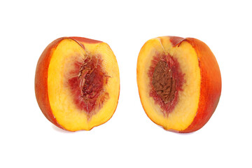 Naklejka na ściany i meble Two halves of a ripe peach isolated on white background