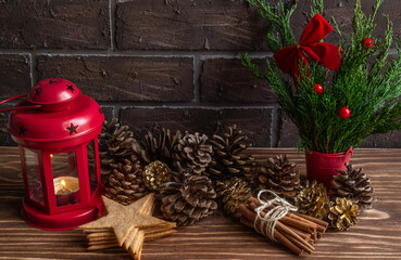  atmospheric Christmas or New Year composition, pine cones, burning candle, gingerbread cookies. Cozy, Copy space