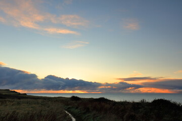 Naklejka na ściany i meble Sunrise over the North sea from the Yorkshire coast, UK.