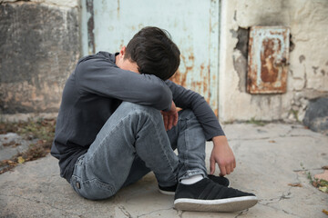 depressive young man in street