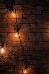 yellow garland on brick background