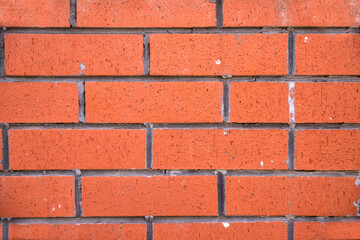 Close-up concrete exterior cracked seamless pattern dirty plaster brick texture.